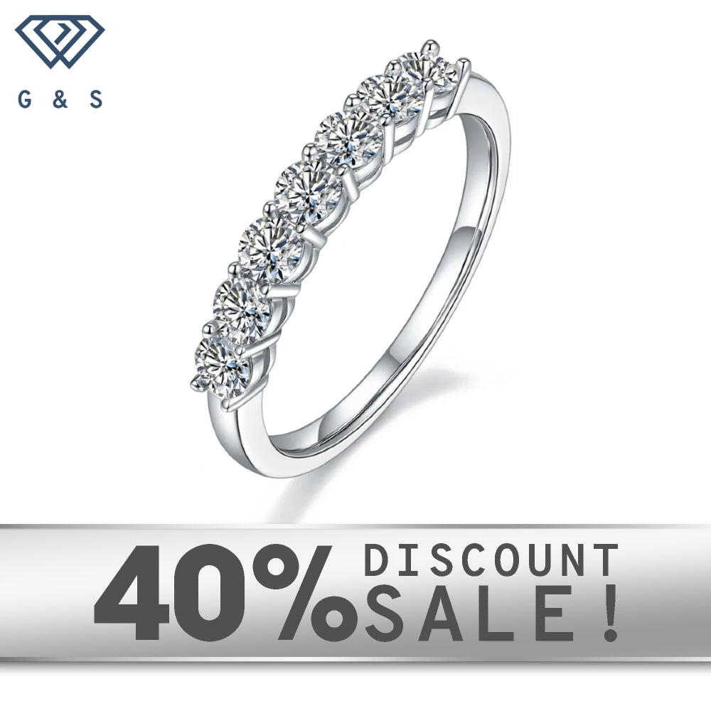A classic and elegant wedding band set featuring seven sparkling stones in a half-eternity design.