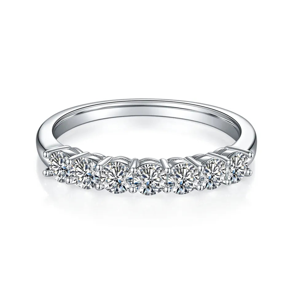 A beautiful wedding band set crafted in 9ct white gold, showcasing a stunning half-eternity row of seven sparkling stones.