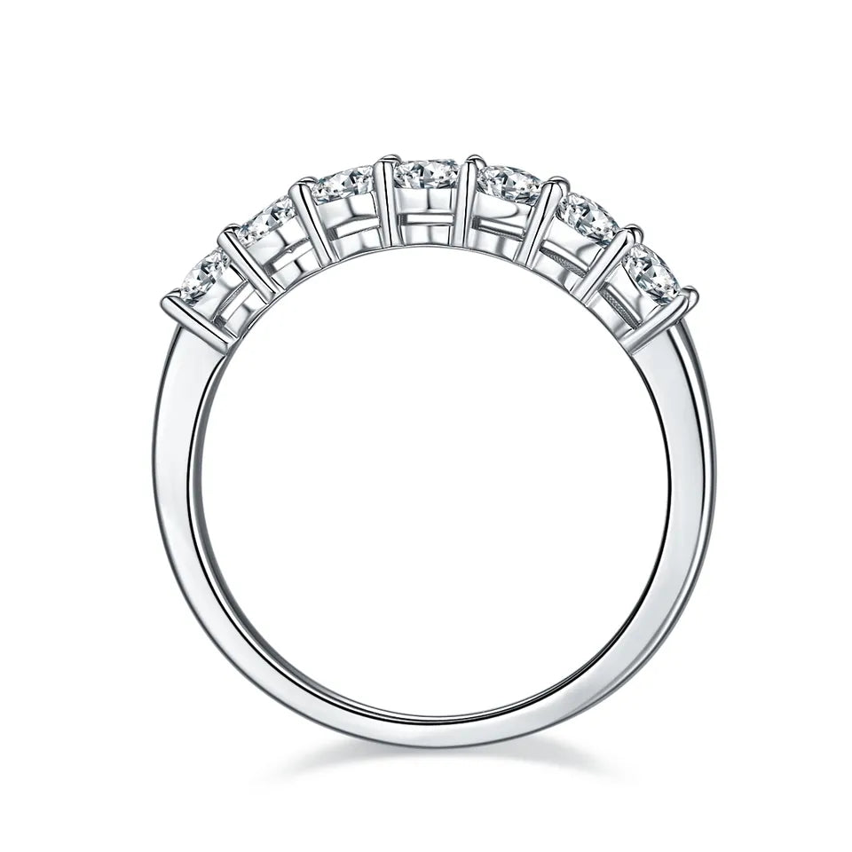 This 9ct white gold wedding band set features a dazzling half-eternity row of seven stones, perfect for adding sparkle to your wedding day.