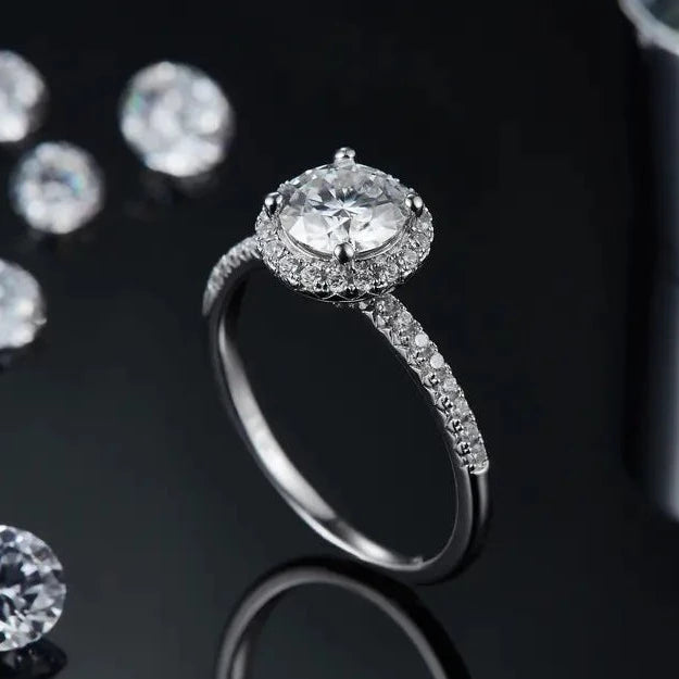 A traditional halo design highlighting a 1.00ct moissanite center stone.