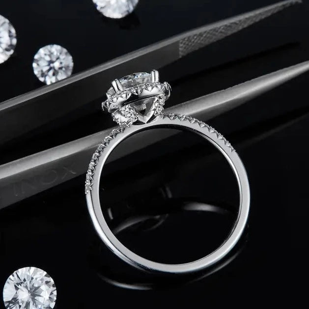 An elegant engagement ring featuring a 1.00ct moissanite in a timeless halo design.
