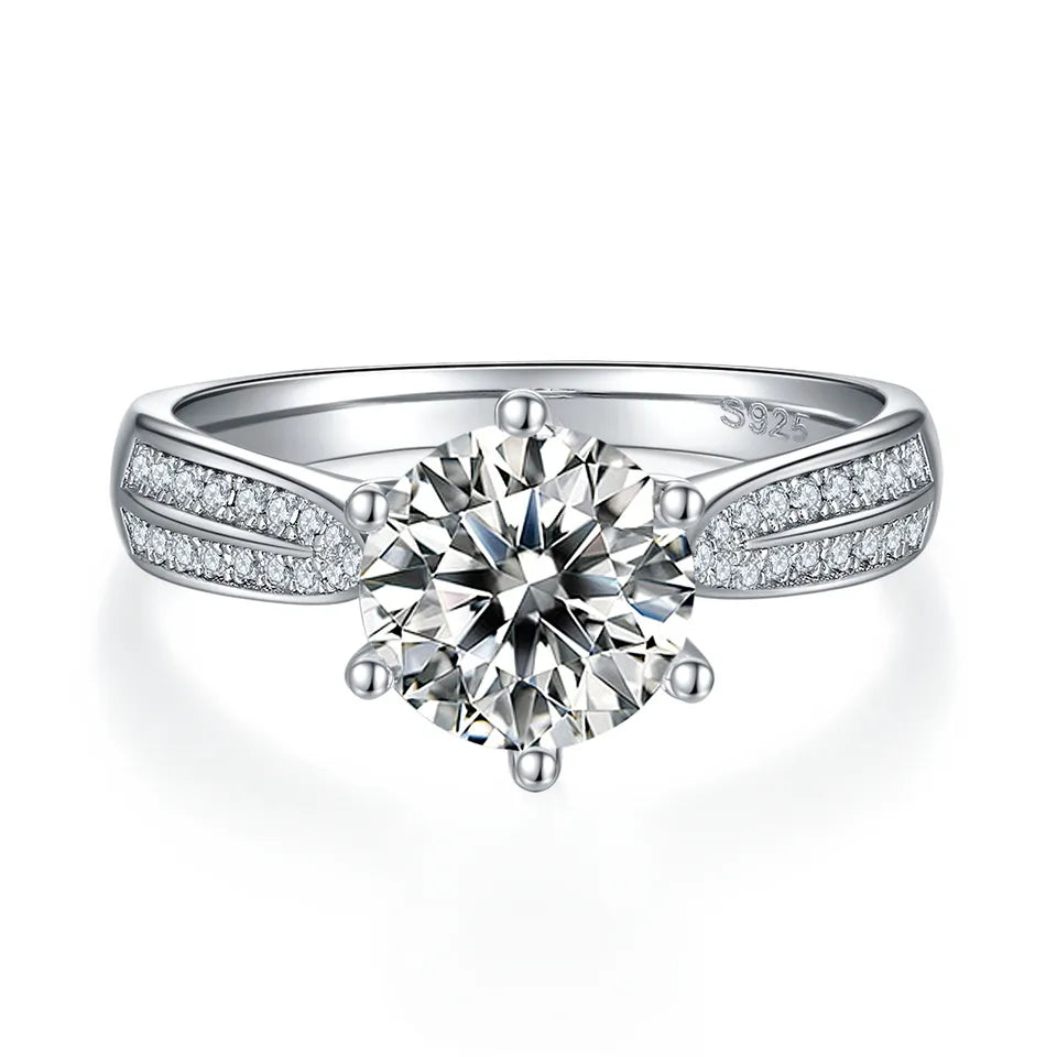 This elegant engagement ring features a 2.00ct moissanite center stone with a sparkling pave halo and band, crafted in high-quality sterling silver.
