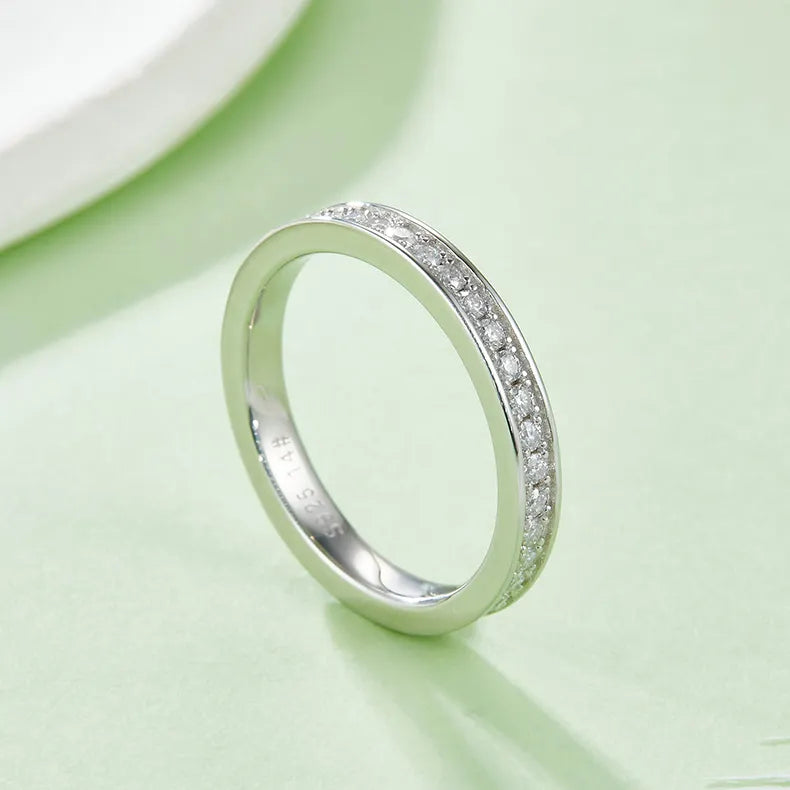This ring offers timeless elegance with its continuous circle of shimmering pavé-set moissanites.
