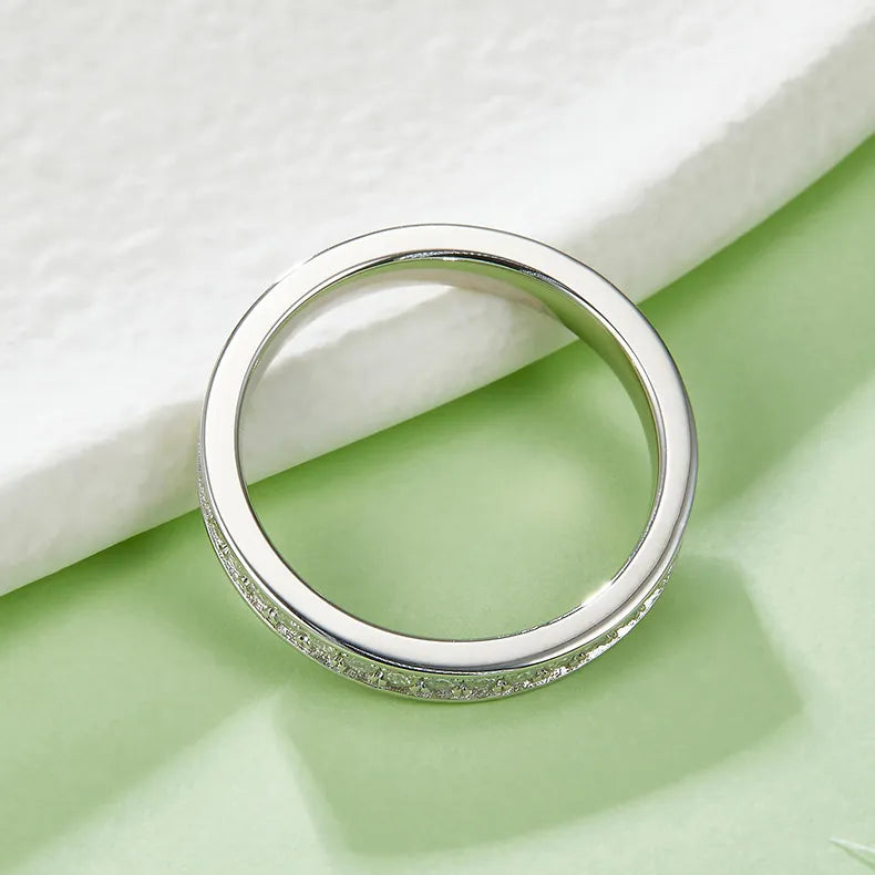 A radiant full eternity band featuring pavé-set moissanites, ideal for adding sparkle to any ring stack.