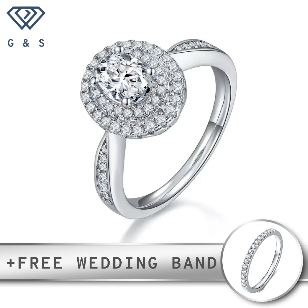 A stunning engagement ring featuring a 1.00ct oval cut moissanite surrounded by two concentric halos of sparkling stones.