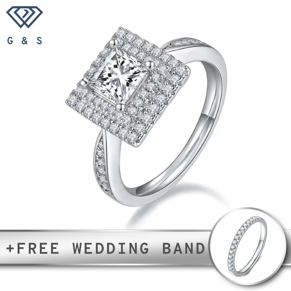 A stunning engagement ring featuring a 1.00ct princess cut moissanite surrounded by a double halo of sparkling stones.