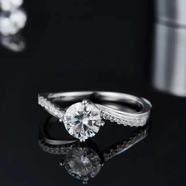 A radiant engagement ring featuring a 1.00ct moissanite that captures the light, set in a durable and lustrous sterling silver band.