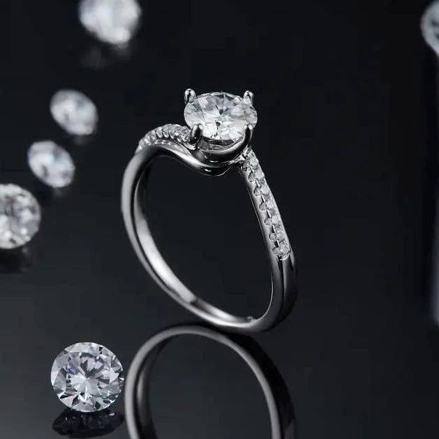Enjoy the brilliance of a 1.00ct moissanite in a beautifully crafted sterling silver setting, offering an elegant and budget-friendly engagement option.