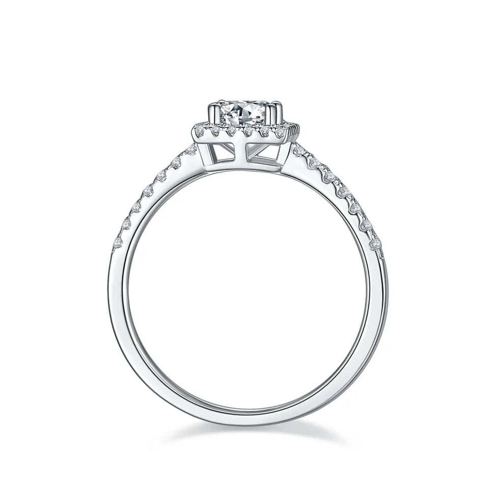 A timeless design with a 0.50ct moissanite center stone and a halo of accent stones, set in high-quality sterling silver.