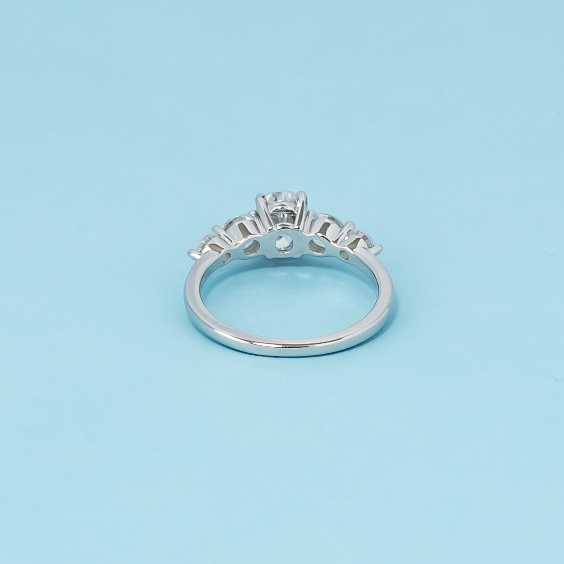 Luxurious 9ct white gold engagement ring with five beautiful oval cut moissanites, symbolizing enduring love and commitment.