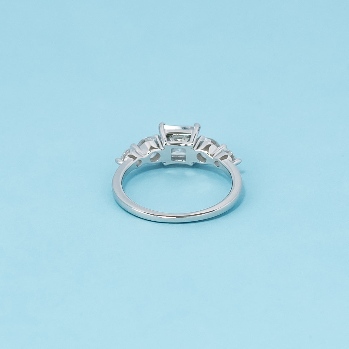 Luxurious 9ct white gold engagement ring with five beautiful princess cut moissanites, symbolizing enduring love and commitment.