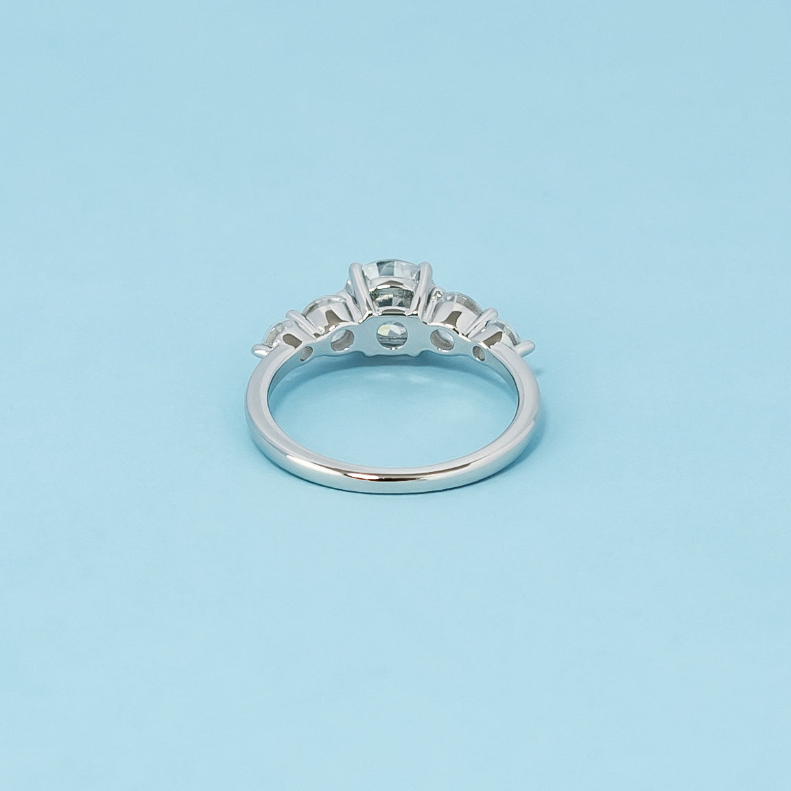 Luxurious 9ct white gold engagement ring with five exceptionally beautiful round brilliant moissanites, symbolizing enduring love and commitment.