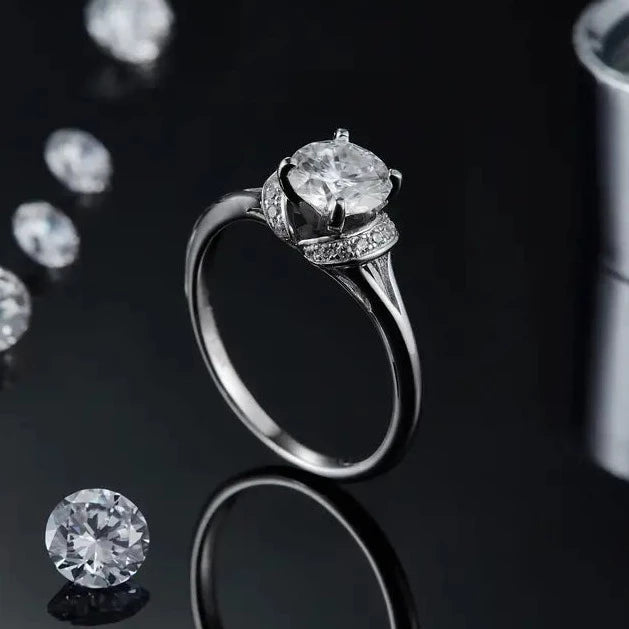 A stunning sterling silver ring featuring a 1.00ct moissanite, meticulously set to maximize its brilliance and fire.