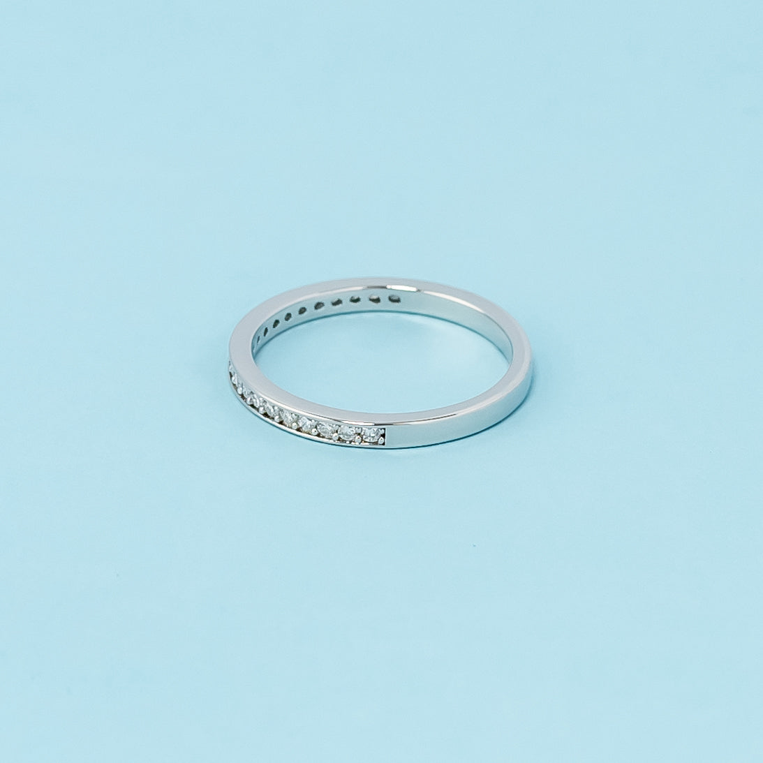 A beautiful and enduring wedding band crafted from 9ct white gold and embellished with pave-set moissanites.