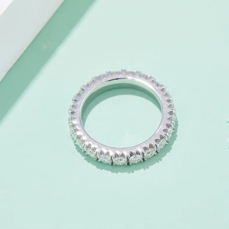 A simple yet elegant band with stones set all the way around, ideal for stacking.