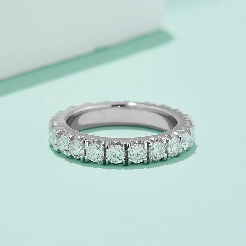 A close-up shot showcasing the setting and sparkle of the stones around the entire ring.