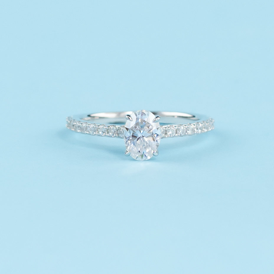 Elegant 9ct white gold engagement ring with a hidden setting that highlights the brilliance of the oval cut moissanite.