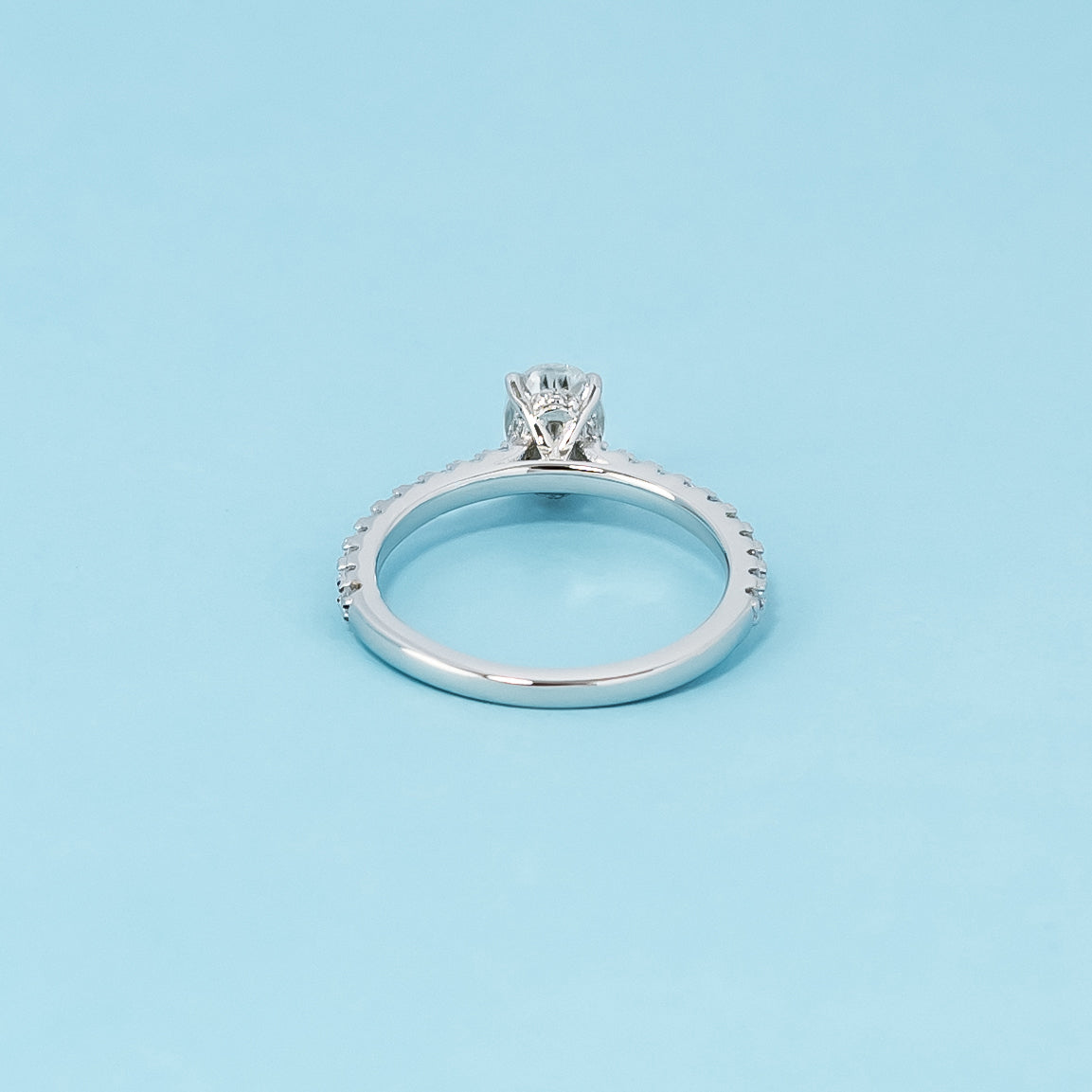 Luxurious 9ct white gold engagement ring featuring a discreet setting that emphasizes the sparkle and beauty of the oval cut moissanite.