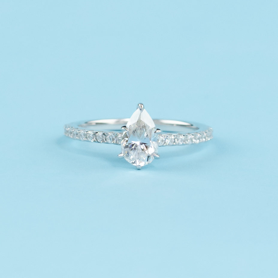 Elegant 9ct white gold engagement ring featuring a hidden setting that accentuates the sparkle of the pear-shaped moissanite.