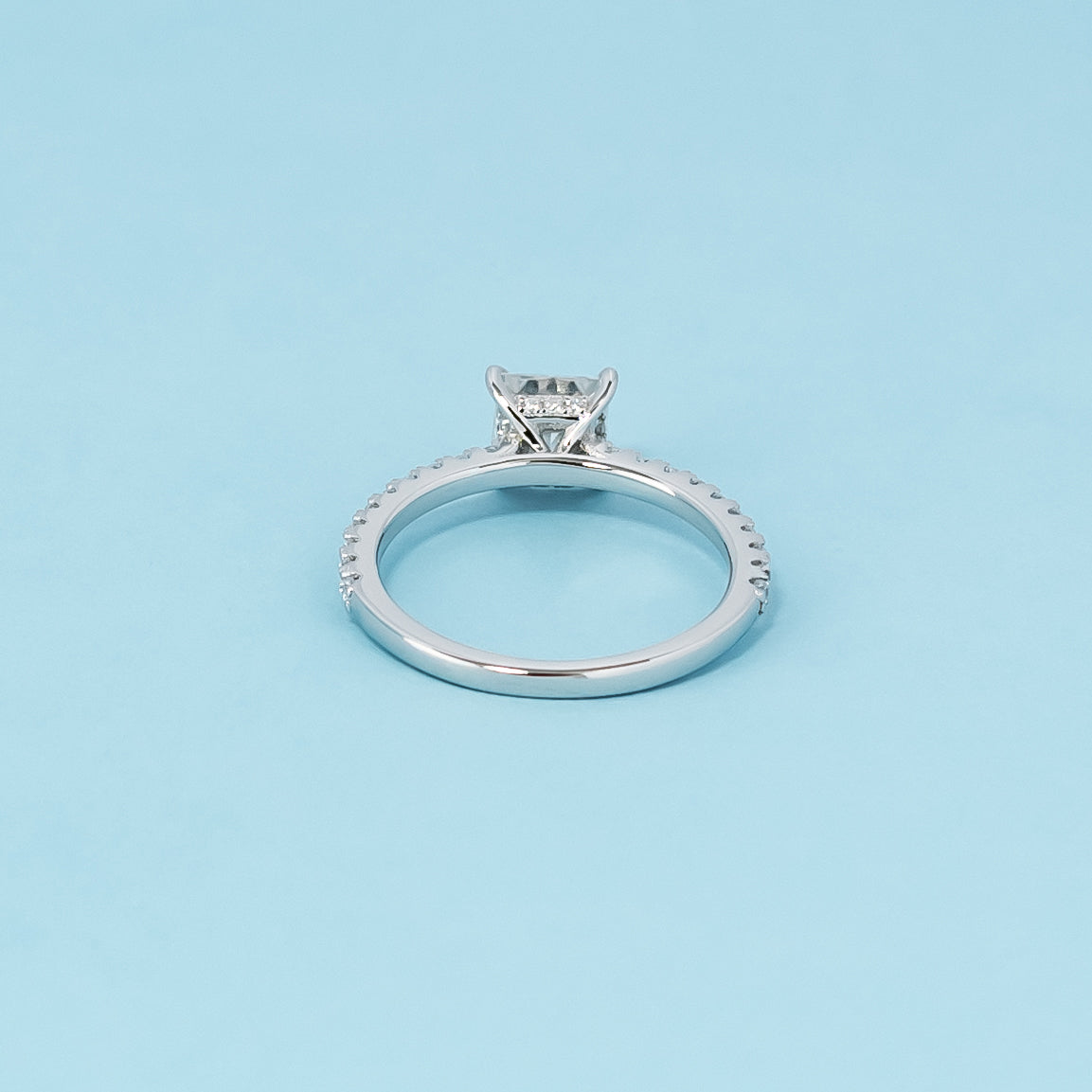 Luxurious 9ct white gold engagement ring with a beautifully concealed setting that highlights the brilliance of the princess cut moissanite.
