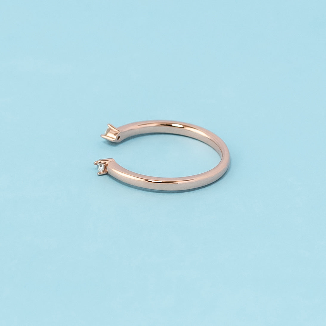 Beautiful and romantic wedding band set crafted in 9ct rose gold with moissanites, perfect for celebrating infinite love.