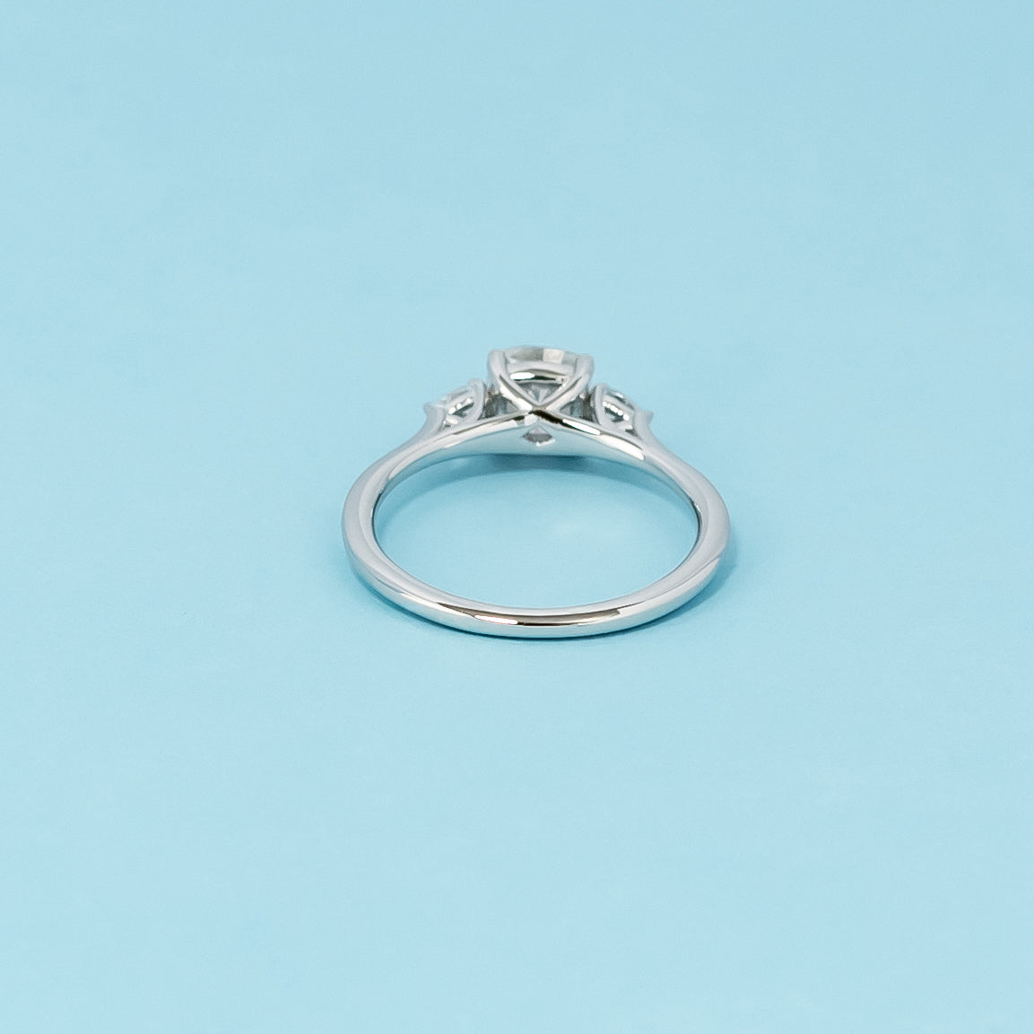 Luxurious 9ct white gold engagement ring with three beautiful cushion cut moissanites in a timeless trilogy setting, symbolizing infinite love.