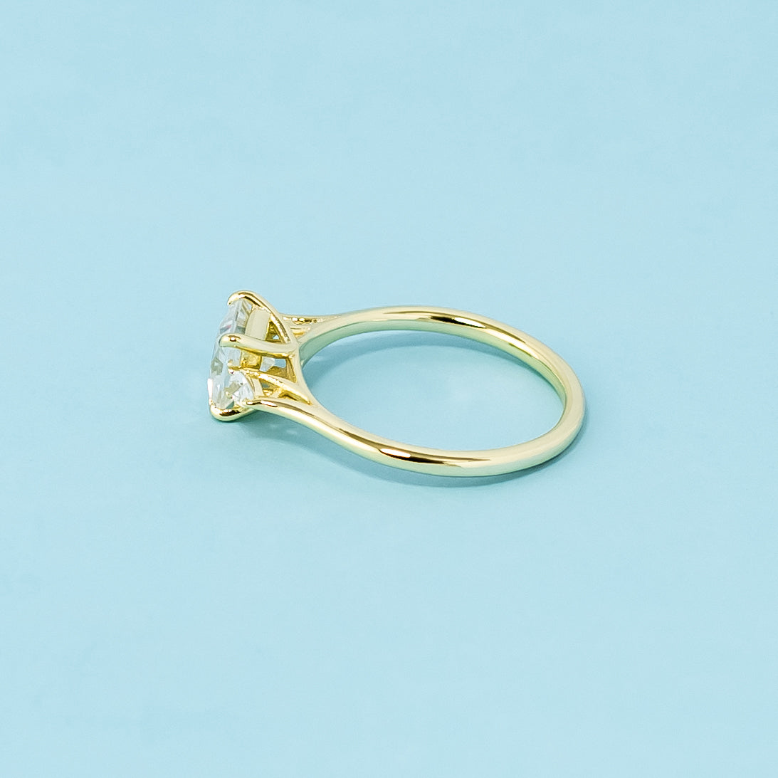 A beautiful trilogy design with three stunning princess cut moissanites, representing infinite love.