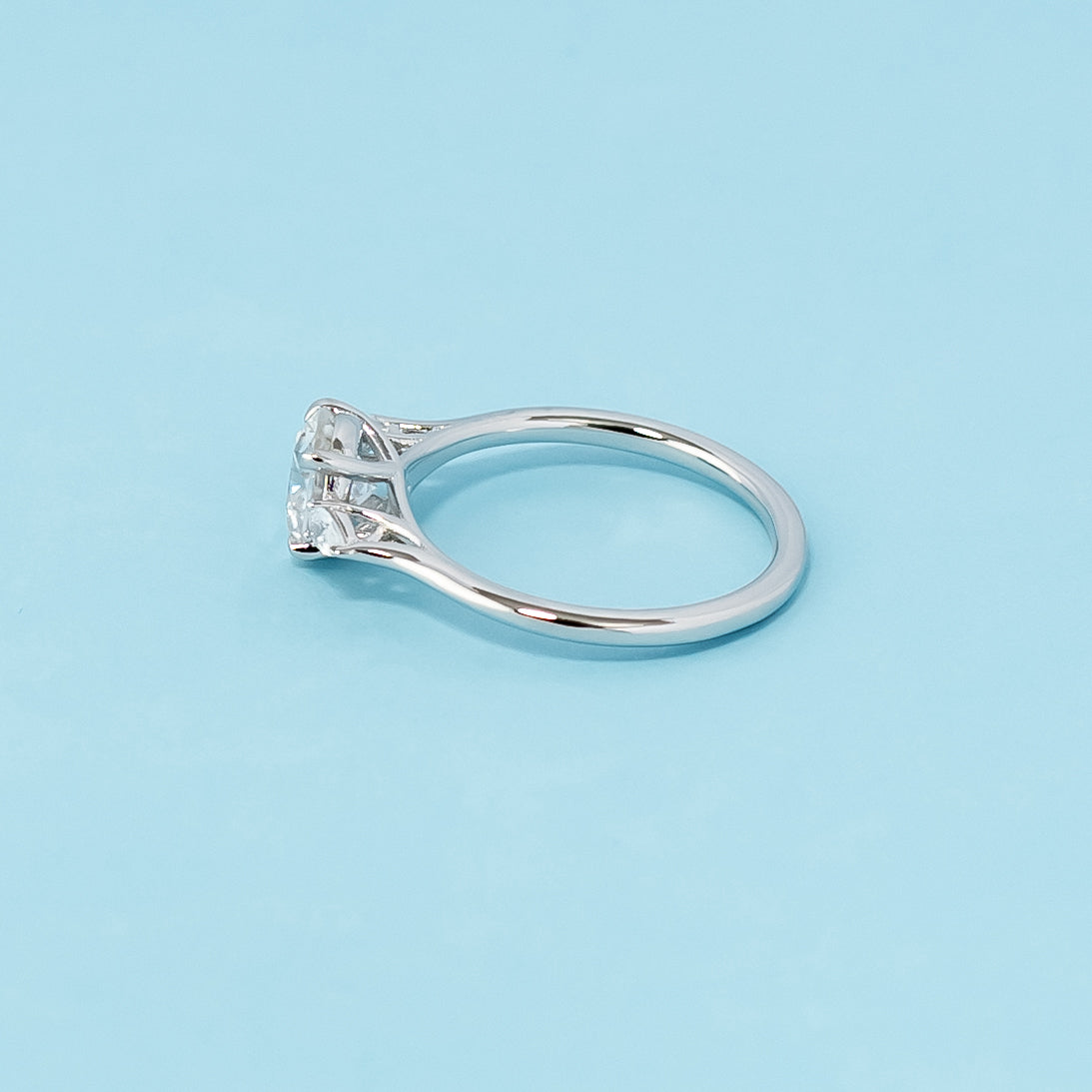 Modern and meaningful engagement ring showcasing round brilliant moissanites symbolizing past, present, and future love, set in 9ct white gold.