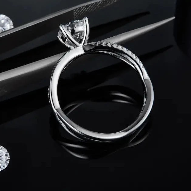 A meaningful engagement ring made of sterling silver, highlighting a 1.00ct moissanite and a band representing eternal love through its infinity design.