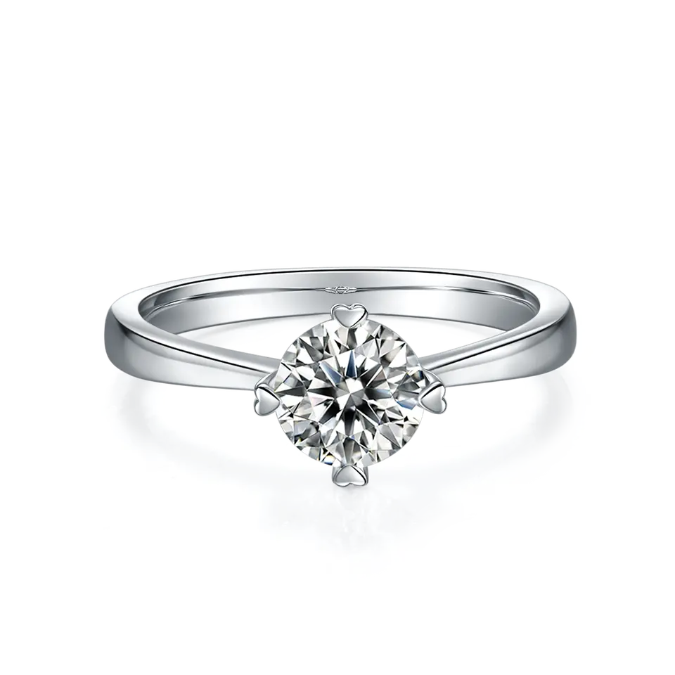 A simple yet romantic sterling silver ring with a brilliant 1.00ct moissanite, highlighted by unique heart-shaped prongs.