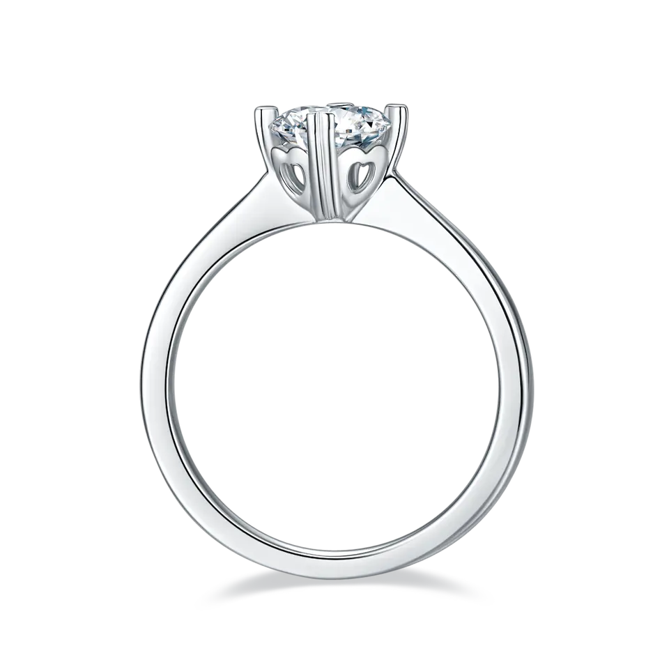 This ring showcases a dazzling 1.00ct moissanite solitaire in a charming sterling silver setting, featuring four heart-shaped claws.