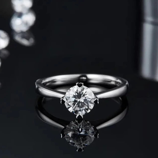 The light reflects beautifully on the moissanite stone.
