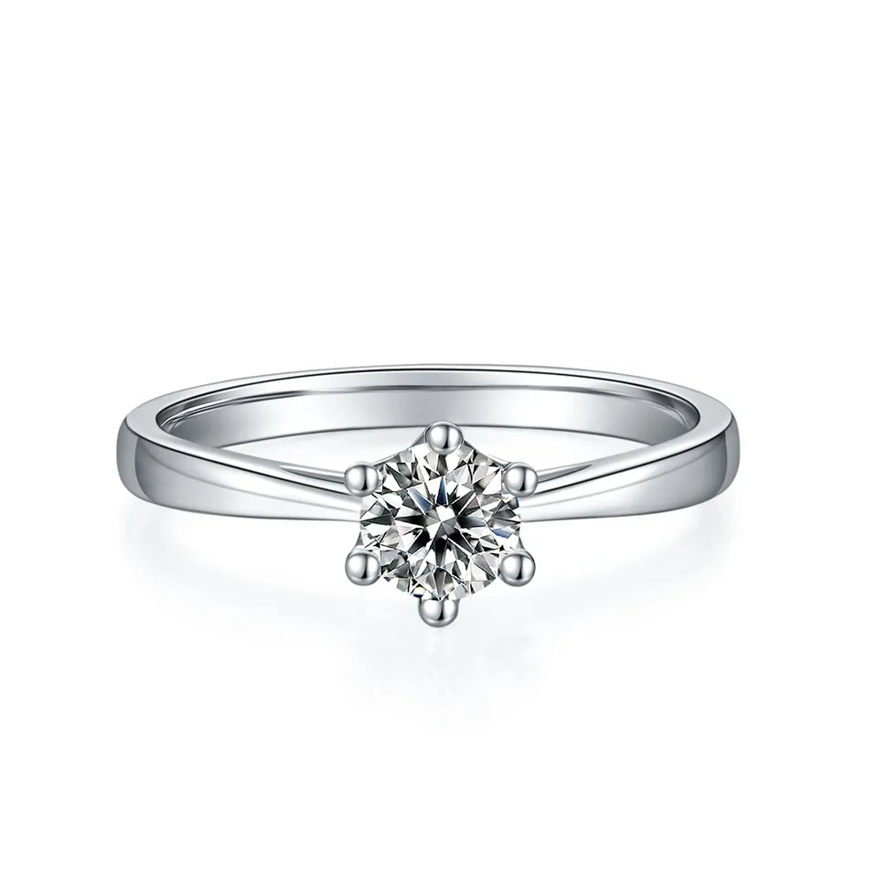 An elegant engagement ring showcasing a 0.50ct moissanite in a 6-prong setting with a detailed floral basket design.