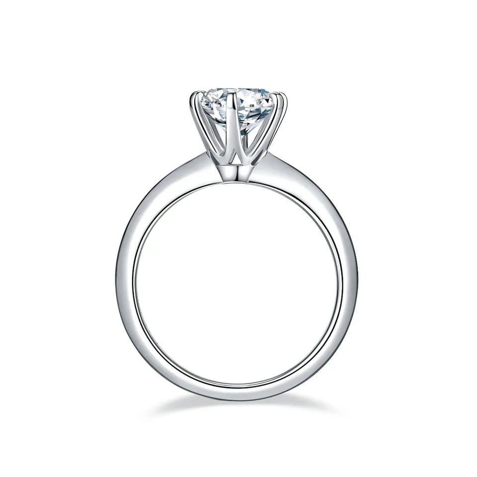 This sterling silver ring features a dazzling 1.50ct moissanite in a refined 6-prong setting, creating a timeless and elegant design.