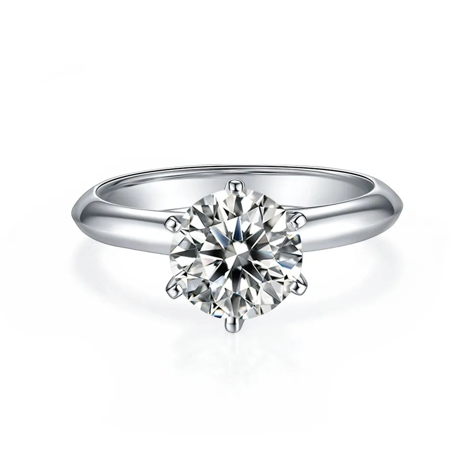 A stunning solitaire ring with a 2.00ct moissanite held securely by six prongs in a Tiffany-style setting, all in high-quality sterling silver.