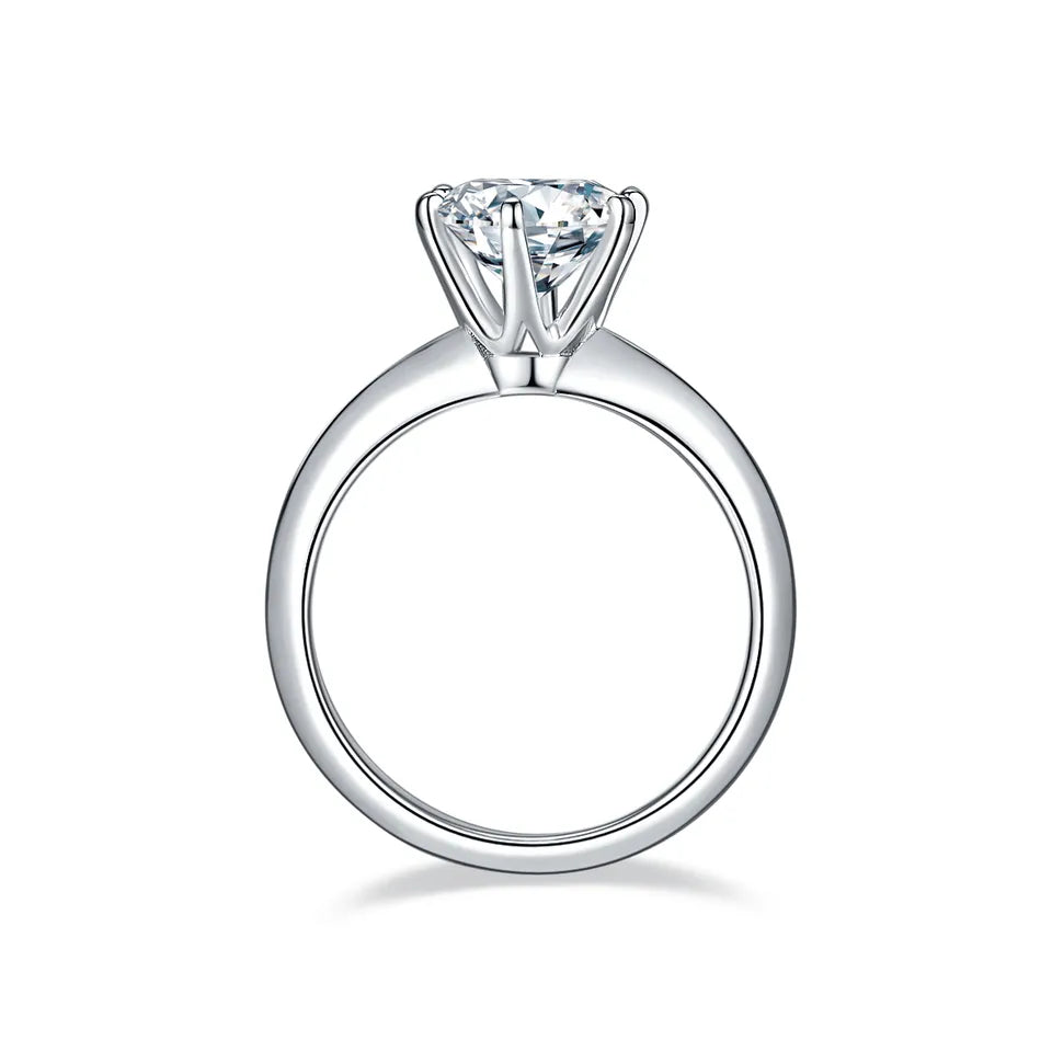 This ring showcases a dazzling 2.00ct moissanite in a traditional 6-claw setting, set in a sleek sterling silver band.