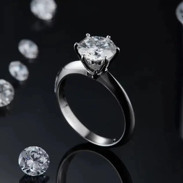 A refined engagement ring featuring a 2.00ct moissanite set in a classic Tiffany 6-claw setting, crafted from lustrous sterling silver.