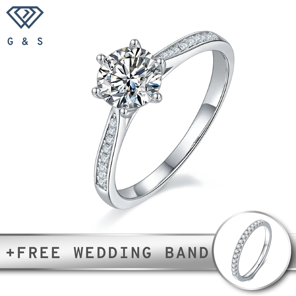 A classic engagement ring featuring a 1.00ct moissanite center stone, flanked by tapered bands of pave-set moissanites, all set in polished sterling silver.