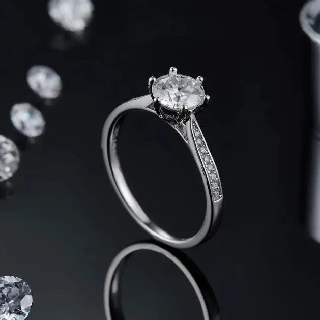 A timeless 1.00ct moissanite engagement ring set in 9ct white gold, featuring a modern tapered pave design for added sparkle.