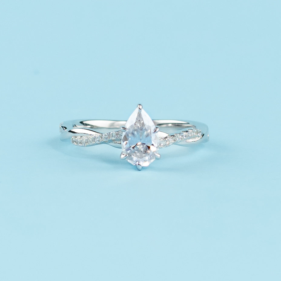 9ct White Gold Engagement Ring featuring a Pear Shape Moissanite with an Infinity Band.