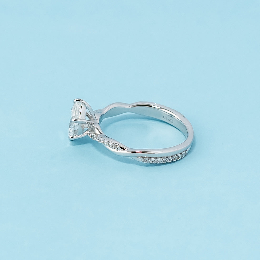 Express Eternal Love with this Timeless Infinity Pear Shape Moissanite Engagement Ring in 9ct White Gold.