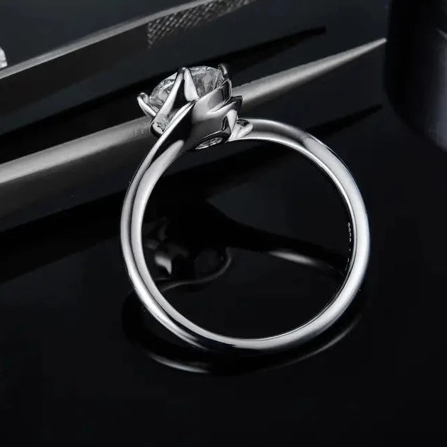 A timeless engagement ring combining the brilliance of a 1.00ct moissanite with the unique design of a twist basket setting in sterling silver.