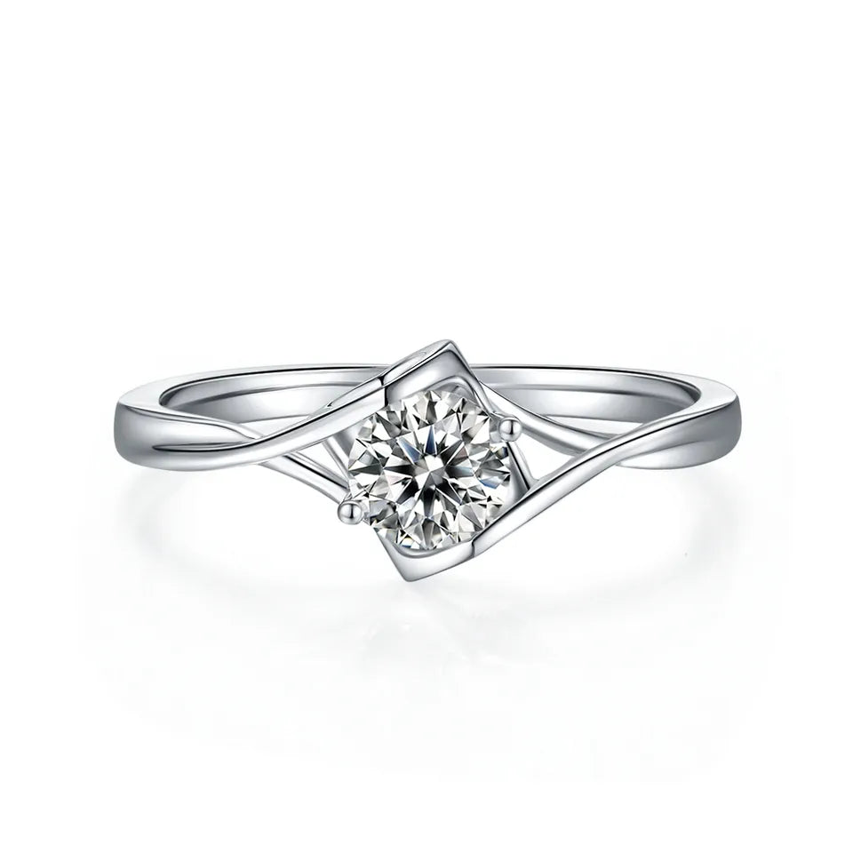 This romantic ring showcases a brilliant 0.50ct moissanite set within a distinctive two-heart design, crafted from high-quality sterling silver.