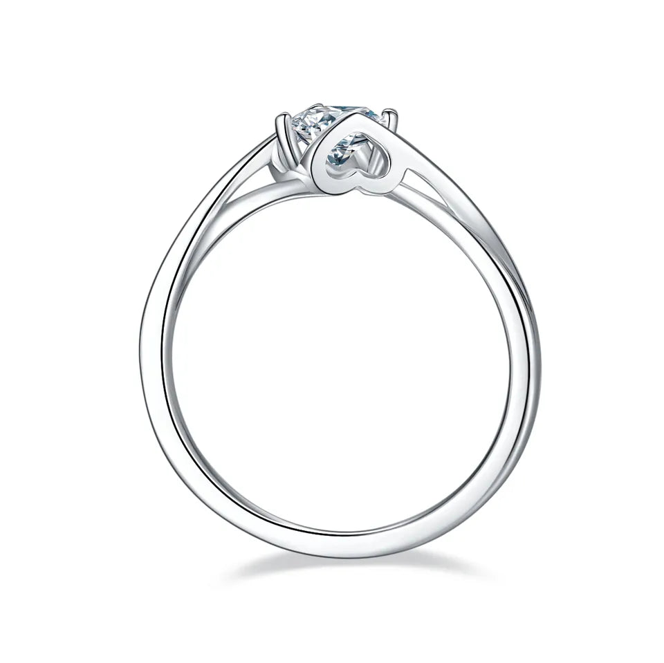 A captivating engagement ring featuring a 0.50ct moissanite held by a unique two-heart setting, elegantly crafted in sterling silver.
