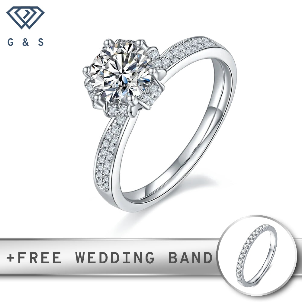A classic vintage-inspired engagement ring featuring a 1.00ct moissanite center stone, surrounded by delicate pave-set moissanites, all set in sterling silver.