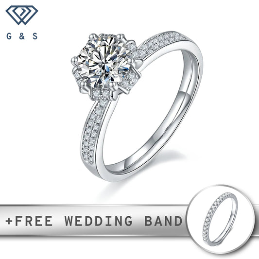 A classic vintage-inspired engagement ring featuring a 1.00ct moissanite center stone, surrounded by delicate pave-set moissanites, all set in sterling silver.