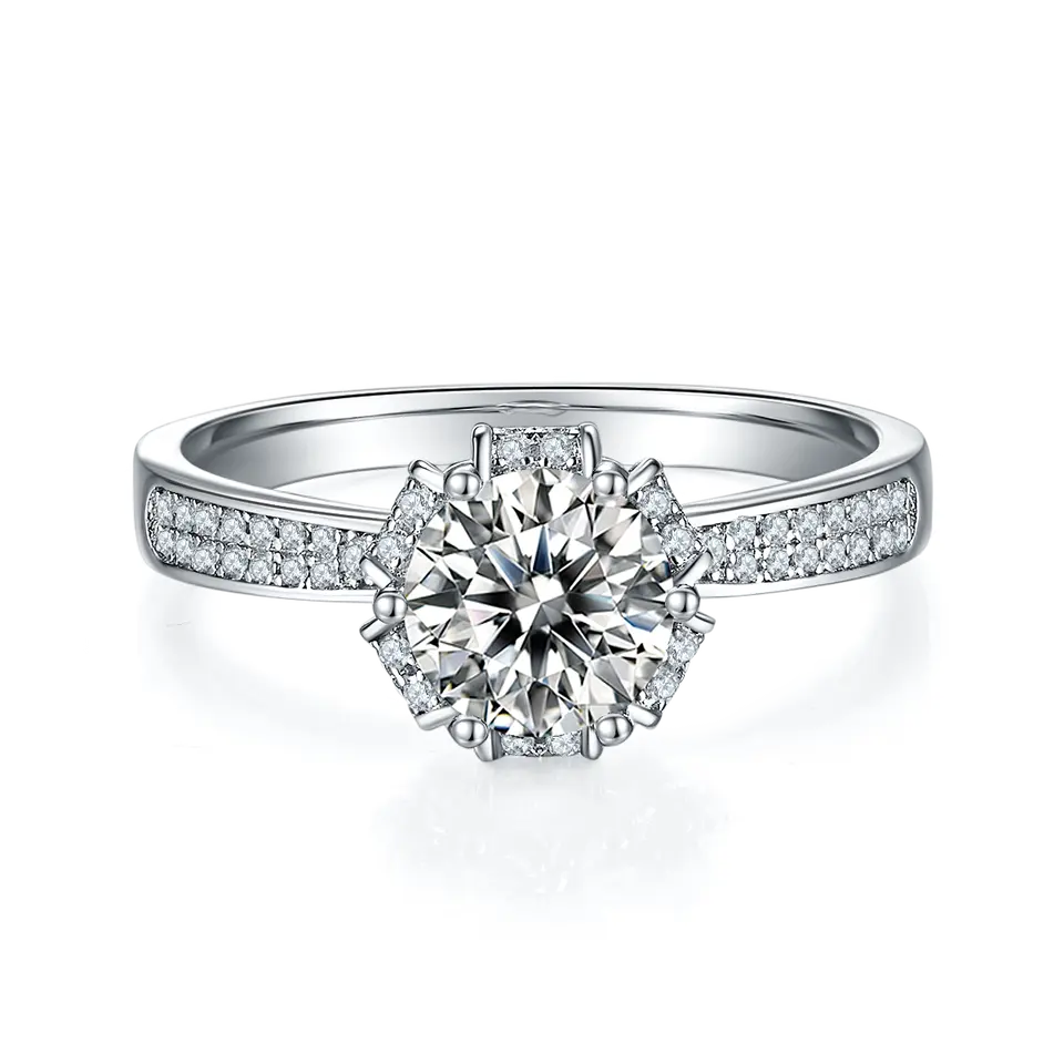 This ring showcases a 1.00ct moissanite with a vintage design, featuring intricate pave detailing and a polished sterling silver band.