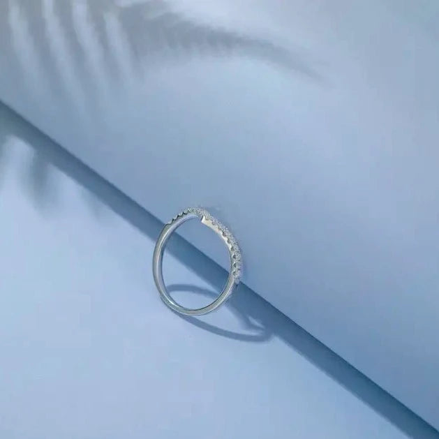 A charming and delicate wedding band set featuring a wishbone design accented with sparkling moissanites, all in 9ct white gold.