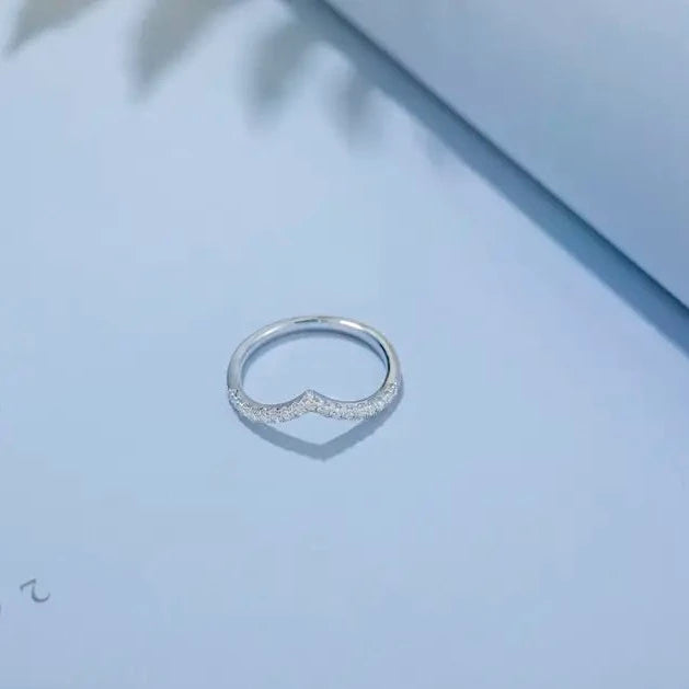 These 9ct white gold wedding bands offer a unique twist on a classic design, featuring a wishbone shape and the brilliance of moissanites.
