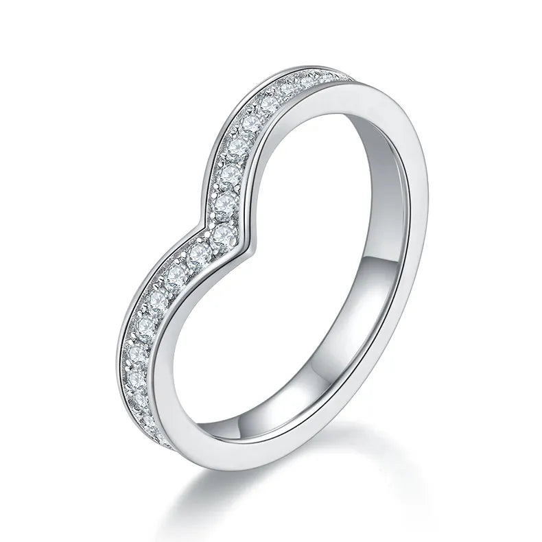 A beautiful stacking ring featuring a wishbone shape set with pave moissanites, designed to be worn alone or layered with other rings.